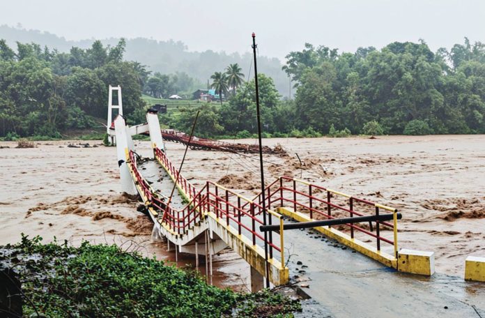 A landslide triggered by relentless rains brought by the southwest monsoon engulfs part of a residential area in Barangay Nagba, Tubungan, Iloilo on Sunday, July 12, killing a 67-year-old resident and underscoring the dangers posed by rain-soaked slopes. PHOTO FROM JUNJUNSKIE / TUBUNGAN PNP FACEBOOK PAGE