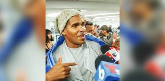 Luis Manuel Otero Alcántara speaks to journalists at Miami airport. AFP VIA GETTY IMAGES