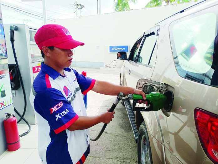 diesel_prices_copy_compressed_resized A gas station attendant fills up a car fuel tank in Pavia, Iloilo. Diesel prices could rise by P1 to P3 per liter while gasoline prices could either fall by up to P1 per liter or increase by as much as P1 per liter on July 7, 2026. AJ PALCULLO/PN