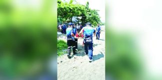 Emergency responders and local police retrieve the body of the 47-year-old drowning victim, alias “Victor,” along the coast of Barangay Dumrog, Pandan, Antique on July 6, 2026. The victim was rushed to the hospital but failed to survive. PANDAN MDRRMO PHOTO