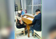 Ex-cop wanted for murder surrenders to PRO-6 Alias “Jerry” (left), a former police officer facing murder charges, surrenders to Police Regional Office 6 acting director Brigadier General Randulf T. Tuaño at around 12:45 a.m. on July 5, 2026. PRO-6 PHOTO