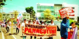 PEOPLE’S SONA. Members of various sectoral groups march toward the Iloilo Provincial Capitol in Iloilo City on Monday, July 27, 2026, to hold a counter-protest dubbed the "People's State of the Nation Address." Coinciding with President Ferdinand Marcos Jr.’s fifth SONA, demonstrators voiced frustration over low wages, rising commodity prices, corruption, and unfulfilled agricultural reforms. ALLEN ANIMAS/PN