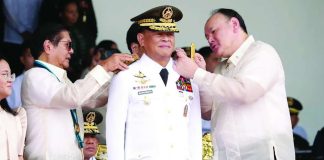President Ferdinand R. Marcos Jr. (left) and Department of National Defense Secretary Gilberto Teodoro Jr. (right) pin the four-star rank insignia on the new Armed Forces of the Philippines (AFP) chief of staff, Lieutenant General Antonio G. Nafarrete, during the AFP change-of-command ceremony at Camp General Emilio Aguinaldo in Quezon City on Tuesday, July 21. RTVM PHOTO