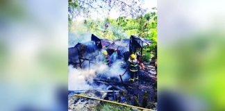 Personnel from the Bureau of Fire Protection-Hamtic work to extinguish a residential fire in Barangay Igbical, Hamtic, Antique, on Saturday morning, July 18, 2026. PHOTO COURTESY OF GONZAGA VLOG