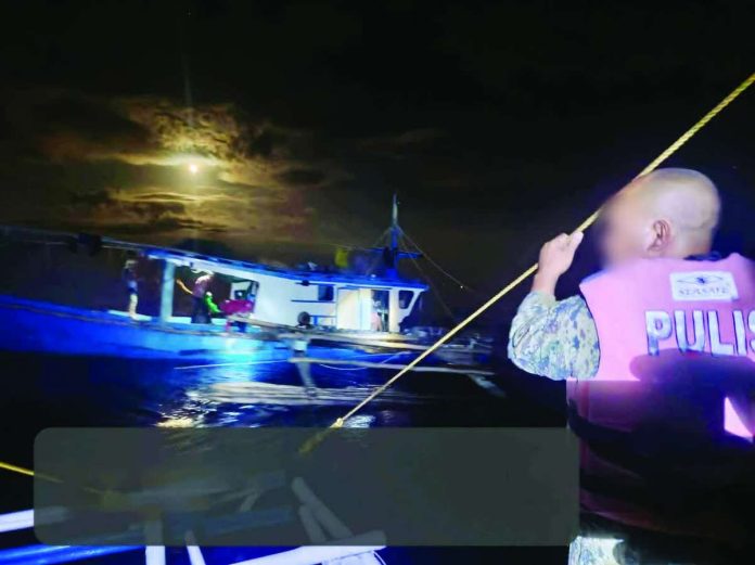 illegal_fishing_compressed_resized One of the five fishing boats intercepted for alleged violation of Section 86 of Republic Act No. 10654 during a seaborne patrol operation at around 3:30 a.m. on July 5, 2026 off Sitio Baligiuan, Barangay Malangabang in Concepcion, Iloilo. Authorities said all boat captains are residents of Victorias City, Negros Occidental. PHOTO COURTESY OF 2ND IPMFC