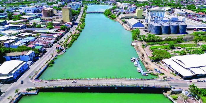 iloilo river An aerial shot of the Iloilo River shows its calm and clean waters flowing past the Esplanade and surrounding commercial establishments. The Iloilo City Government is stepping up inspections on local establishments along the river to ensure strict compliance with wastewater regulations after improper grease disposal was reported. PHOTO COURTESY OF MAYO RAISA TREÑAS FACEBOOK PAGE