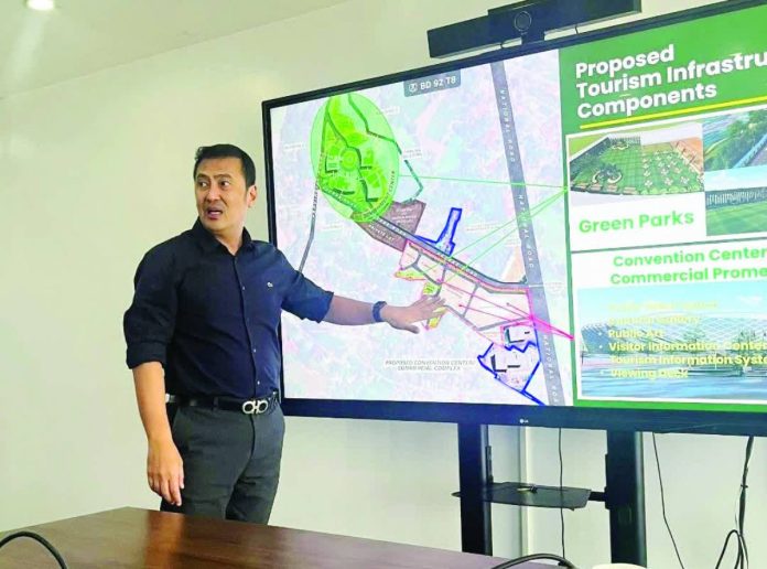 ime convention center copy_compressed Tourism Infrastructure and Enterprise Zone Authority chief operating officer Mark Lapid reviews the proposed convention and events facility to be constructed at the Smart Green Government Center in Santa Barbara, Iloilo during his meeting with Gov. Arthur Defensor Jr. in Metro Manila on July 28. The province is seeking TIEZA funding for the project, which is envisioned to strengthen Iloilo’s position as a premier destination for national and international events. BALITA HALIN SA KAPITOLYO PHOTO