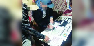Janiuay police personnel process confiscated evidence alongside suspects following a successful buy-bust operation in Delos Santos Subdivision, Barangay Jibolo, Janiuay, Iloilo on July 28, 2026. The operation yielded 374,000 worth of suspected shabu. IPPO PHOTOS
