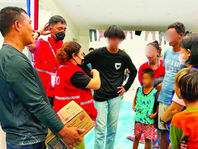 mai neljoy Badjao DSWD photo (1)_compressed The Department of Social Welfare and Development - Region 6’s Quick Response Team provided family food packs and sleeping kits to the rescued Badjaos Miag-ao, Iloilo. They also offered psychosocial support services to address the emotional needs of the displaced families. DSWD WESTERN VISAYAS