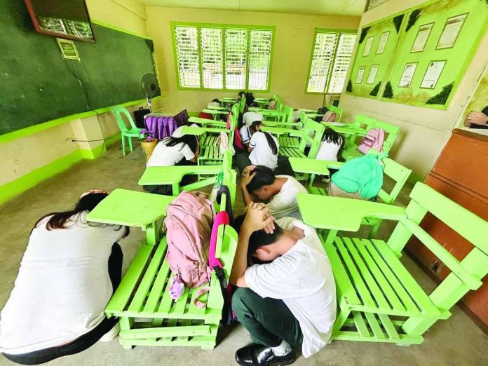 mai_OCD_drill_copy_compressed_resized Learners of Alberto Sorongon Sr. Memorial National High School in Pototan, Iloilo execute the “duck, cover and hold” during the 2nd Quarter Nationwide Simultaneous Earthquake Drill on June 18, 2026. The Office of Civil Defense in Western Visayas will continue conducting earthquake drills. MDRRMC-POTOTAN FACEBOOK