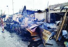 Residents inspect what remains of their homes and properties in Barangay Muelle Loney, City Proper district after a fire broke out early Monday morning, July 25, 2026. PHOTO COURTESY OF DYRP LIFE RADIO ILOILO