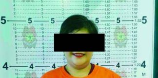 Capiz broadcaster India O. Lavapiez poses for a police booking photograph following the service of a March 2026 arrest warrant issued by the Regional Trial Court, Branch 28, National Capital Judicial Region for cyber libel. Lavapiez is again facing legal trouble after the Office of the Provincial Prosecutor of Capiz found probable cause to charge her with cyber libel over remarks aired on her radio program.