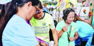 Health workers conduct nutrition assessment and other primary healthcare services for children while indigenous families and residents participate in the PuroKalusugan health caravan in Barangay Buntatala, Jaro, Iloilo City. Organized by the Department of Health in partnership with the Iloilo City Health Office and local stakeholders, the initiative brought free medical consultations, immunization, oral healthcare, health education, and other essential services closer to indigenous peoples and underserved communities. DOH-6