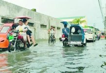 Iloilo eyes lasting flood fix; Drainage master plan to go beyond 421 declogging ops Motorists, cyclists and tricycle drivers carefully make their way through floodwaters along a flooded street in Iloilo City after recent heavy rains, underscoring the continuing risk of urban flooding and the need for residents to remain vigilant against waterborne diseases such as leptospirosis. AJ PALCULLO/PN