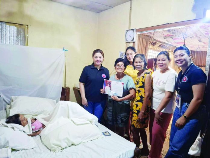 neljoy_senior_copy_compressed_resized HONORING A CENTENARIAN. Officials and personnel of the National Commission of Senior Citizens – Western Visayas visit and present a P100,000 cash gift and certificate to a bedridden centenarian beneficiary as part of the government’s Centenarians Act program. The initiative recognizes Filipinos who have reached 100 years of age for their longevity and lifelong contributions to society. NCSC-6