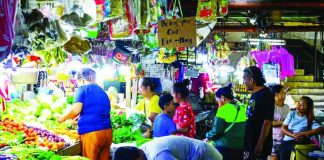 The Department of Trade and Industry says there have been no petitions for price adjustments for basic necessities and prime commodities from manufacturers for now. File photo shows people buying vegetables and other essentials for their daily consumption at the Commonwealth Market in Quezon City. MARIA TAN, ABS-CBN NEWS/FILE PHOTO
