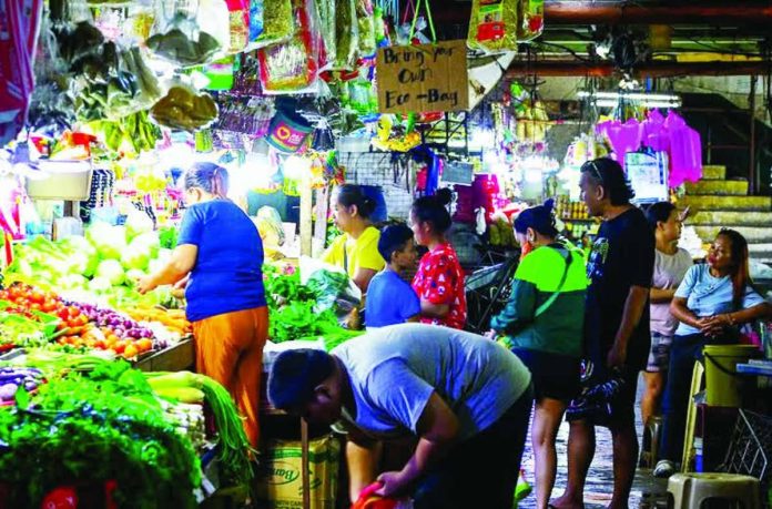 The Department of Trade and Industry says there have been no petitions for price adjustments for basic necessities and prime commodities from manufacturers for now. File photo shows people buying vegetables and other essentials for their daily consumption at the Commonwealth Market in Quezon City. MARIA TAN, ABS-CBN NEWS/FILE PHOTO
