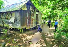 Police personnel inspect the residence of elderly couple Opo and Arceli Sobredo who were found shot to death outside their home in Barangay Salngan, Passi City, Iloilo, on July 5, 2026. Passi City police believe that at least two to three suspects were involved in the killing. PHOTO COURTESY OF DYRI RMN ILOILO