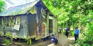 Police personnel inspect the residence of elderly couple Opo and Arceli Sobredo who were found shot to death outside their home in Barangay Salngan, Passi City, Iloilo, on July 5, 2026. Passi City police believe that at least two to three suspects were involved in the killing. PHOTO COURTESY OF DYRI RMN ILOILO
