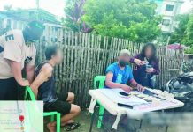 Officers of the Pavia Municipal Police Station arrested alias “Nil” (second from left), a high-value drug suspect, and confiscated around P408,000 worth of suspected shabu on July 13 during a buy-bust operation in Barangay Cabugao Sur, Pavia, Iloilo. IPPO PHOTO