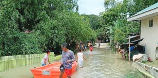 Residents wade through floodwaters in Barangay Jebioc, Pototan, Iloilo on Sunday, July 12, 2026. Jebioc is among the 31 barangays in the municipality hit by widespread flooding brought on by continuous southwest monsoon (habagat) rains. POTOTAN ILOILO NEWS SPOTTED/FACEBOOK PHOTOO PHOTO