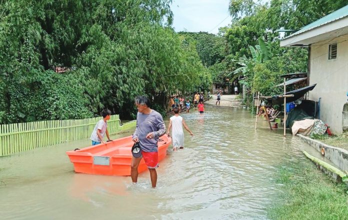 pototan pic Residents wade through floodwaters in Barangay Jebioc, Pototan, Iloilo on Sunday, July 12, 2026. Jebioc is among the 31 barangays in the municipality hit by widespread flooding brought on by continuous southwest monsoon (habagat) rains. POTOTAN ILOILO NEWS SPOTTED/FACEBOOK PHOTOO PHOTO