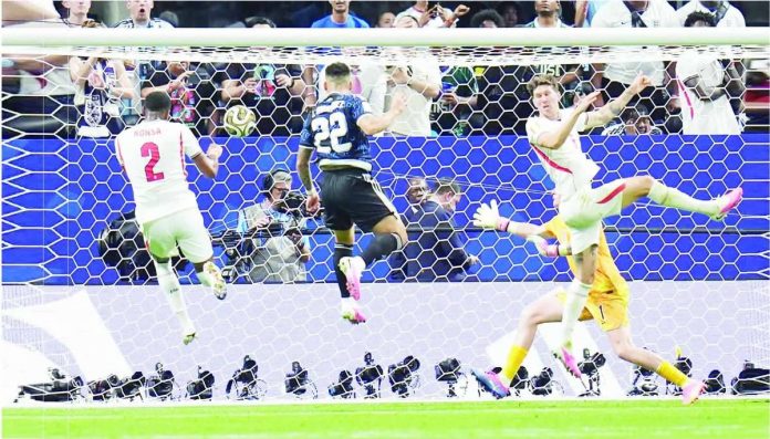Lautaro Martinez heads home the dramatic stoppage-time winner off Lionel Messi's cross as Argentina rallies past England, 2-1, to advance to the FIFA World Cup final against Spain. AP
