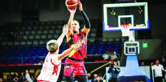 SHOOTING TOUCH. San Miguel Beermen import George King launches a three-pointer over Titan Ultra Giant Risers defender John Amores during the Beermen's emphatic 143-105 victory in the PBA Season 50 Governors' Cup at the Ninoy Aquino Stadium. PBA PHOTO