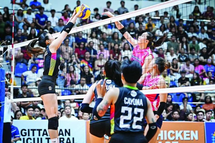 sports_Cool_compressed_resized Creamline Cool Smashers' Michelle Gamit scores through the defense of the Nxled Chameleons during their 2026 PVL On Tour Showdown opener at Capital Arena in Isabela. PVL
