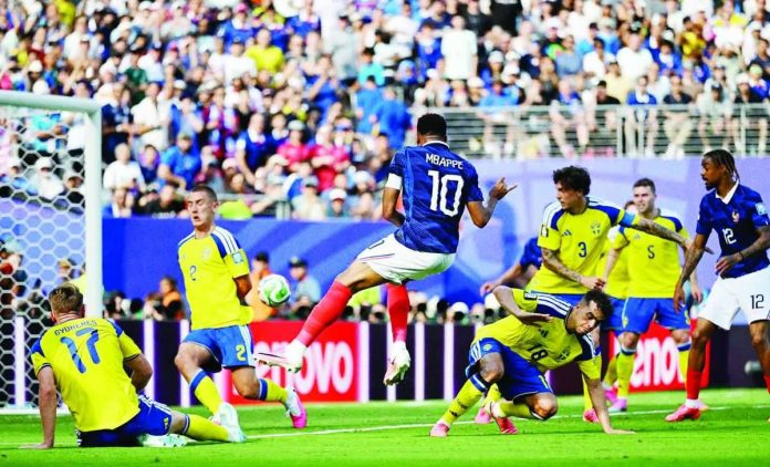 sports_FIFA_copy_compressed_resized France’s Kylian Mbappé celebrates after scoring the opening goal in Les Bleus’ 3-0 victory over Sweden to reach the FIFA World Cup Round of 16. ESPN ASIA