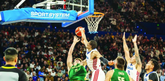 Gilas Pilipinas forward Michael Phillips contests a shot by an Australian Boomers player during their FIBA Basketball World Cup 2027 Asian Qualifiers game at RAC Arena in Perth, Australia.