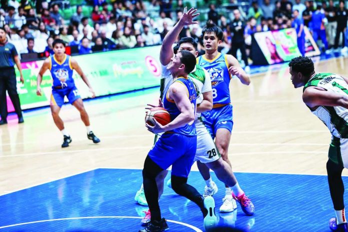 sports_NLEX_compressed_resized NLEX Road Warriors’ Robert Bolick Jr. drives to the basket against the defense of Terrafirma Dyip's Justin Strings during their PBA Season 50 Governors’ Cup clash at the Ynares Center in Montalban, Rizal. PBA PHOTO