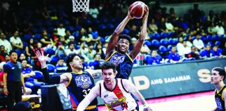NLEX Road Warriors import DeQuan Jones grabs a rebound over San Miguel Beermen's Rodney Brondial during the Road Warriors' 110-96 victory that kept them unbeaten and alone atop Group A of the PBA Season 50 Governors' Cup. PBA PHOTO