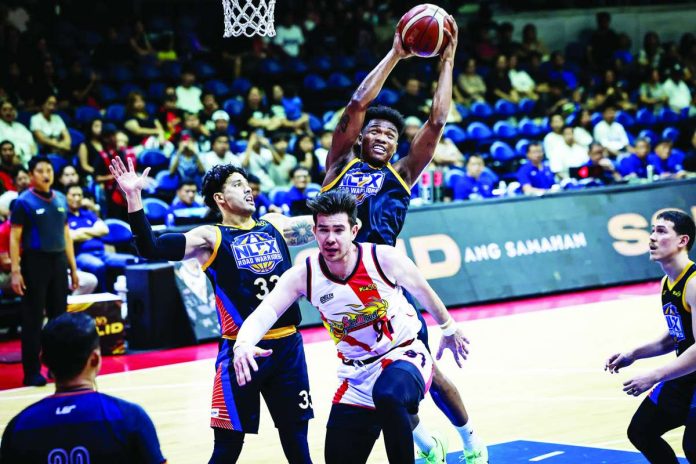 sports_PBA_compressed_resized NLEX Road Warriors import DeQuan Jones grabs a rebound over San Miguel Beermen's Rodney Brondial during the Road Warriors' 110-96 victory that kept them unbeaten and alone atop Group A of the PBA Season 50 Governors' Cup. PBA PHOTO