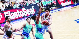 Capiznon center Christian Manaytay of the Rain or Shine Elasto Painters attempts a shot over Phoenix Fuel Masters' Jason Perkins during their PBA Season 50 Governors' Cup clash Tuesday night. PBA photo