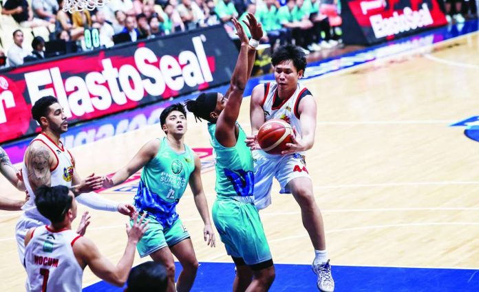 sports_Rain_copy_compressed_resized Capiznon center Christian Manaytay of the Rain or Shine Elasto Painters attempts a shot over Phoenix Fuel Masters' Jason Perkins during their PBA Season 50 Governors' Cup clash Tuesday night. PBA photo
