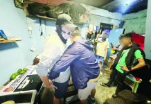 Operatives from the Iloilo City Police Office’s City Drug Enforcement Unit conduct an inventory and body search on alias "Bulldog" following a buy-bust operation in Barangay Ortiz, City Proper district on July 21. Authorities seized around P2.2 million worth of suspected shabu. ICPO PHOTO