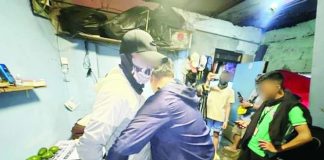 Operatives from the Iloilo City Police Office’s City Drug Enforcement Unit conduct an inventory and body search on alias "Bulldog" following a buy-bust operation in Barangay Ortiz, City Proper district on July 21. Authorities seized around P2.2 million worth of suspected shabu. ICPO PHOTO