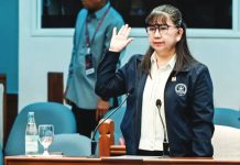 Gina Acosta, former special disbursing officer of the Office of the Vice President, takes her oath before testifying in the impeachment trial of Vice President Sara Duterte-Carpio in the Senate. PHOTO BY NIÑO JESUS ORBETA | INQUIRER