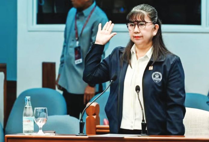 Gina Acosta, former special disbursing officer of the Office of the Vice President, takes her oath before testifying in the impeachment trial of Vice President Sara Duterte-Carpio in the Senate. PHOTO BY NIÑO JESUS ORBETA | INQUIRER