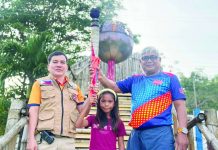 12-year-old Antique heroine honored at Regional Rescuelympics 2026 Office of Civil Defense Regional Office 6 Director Raul E. Fernandez (left) and Broderick G. Train, head of the Provincial Disaster Risk Reduction and Management Office of Antique, pose with 12-year-old Cherry Ann Mateo after she received a Plaque of Heroism and cash assistance during the opening of Rescuelympics 2026 on July 28. Cherry Ann was recognized for her courageous act of swimming for nearly five hours to seek help after a motorboat capsized off Batbatan Island, leading to the successful rescue of all its passengers. PDRRMO ANTIQUE PHOTO