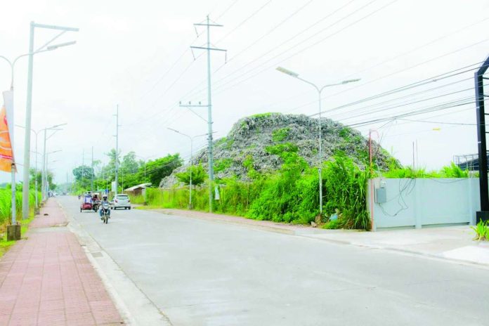 A large pile of waste remains at the former dumpsite along Buri Road in Barangay Mandalagan, Bacolod City, where excavation and development activities have raised concerns over the proper handling and disposal of recovered materials. BCCO PHOTO