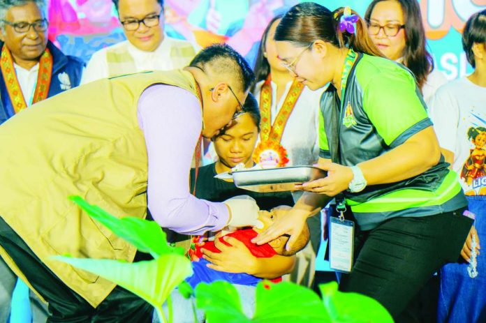 Bacolod_vaccines_copy_compressed_resized Bacolod City officials and health workers led the ceremonial vaccination marking the launch of the “Ligtas Tigdas” Measles-Rubella Supplemental Immunization Activity at the Mansilingan Activity Center on August 10. The city-wide campaign targets 48,839 children aged 6 to 59 months. BCCO PHOTO