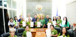Ten retiring barangay health workers posed with Bago City Mayor Mayette Javellana and city officials after receiving gratuity pay in recognition of their decades of service to the city’s communities during a ceremony at the mayor’s office on August 11, 2026. THE CITYBRIDGE PHOTO