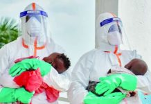 Current Ebola outbreak worst ever in Congo – WHO Two health workers in hazard suits each hold a young baby in the Democratic Republic of Congo. Ebola, which spreads through contact with bodily fluids, has killed 15,000 people across Africa over the last 50 years. REUTERS