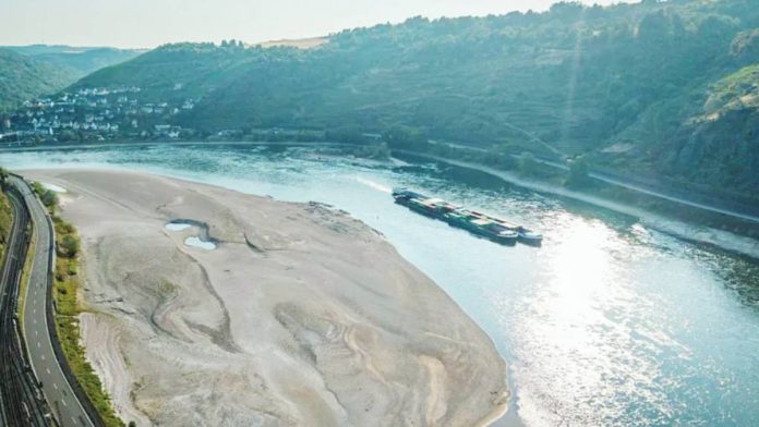 An aerial view as a cargo ship passes a huge exposed sandbar on the Rhine River. The Rhine fell to its lowest ever levels at points in Germany and the Netherlands as heatwave conditions continue. GETTY IMAGES