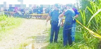 Police investigators examined the roadside where the body of a still-unidentified man, who sustained fatal gunshot wounds, was found in Purok 11, Sitio Tanate, Barangay Aguisan, Himamaylan City, Negros Occidental, on August 9. NEGOCC PPO PHOTO