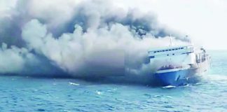 Thick plumes of smoke billow from a fire-hit ferry in Indonesia. Five people have been found dead and 41 are missing as of this writing. OLIVIA IRELAND