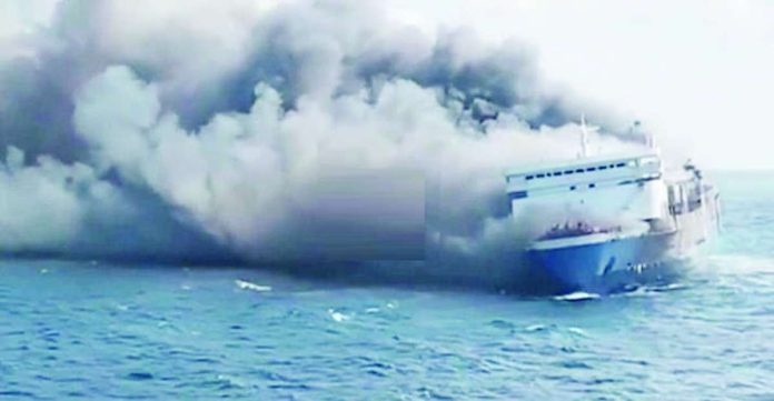 Thick plumes of smoke billow from a fire-hit ferry in Indonesia. Five people have been found dead and 41 are missing as of this writing. OLIVIA IRELAND