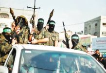 Hamas militants celebrate what they say is a victory over Israel after an eight-day conflict during a rally in the northern Gaza Strip November 22, 2012. Hamas weapons would be handed over to the Board of Peace, United States President Donald Trump said. REUTERS
